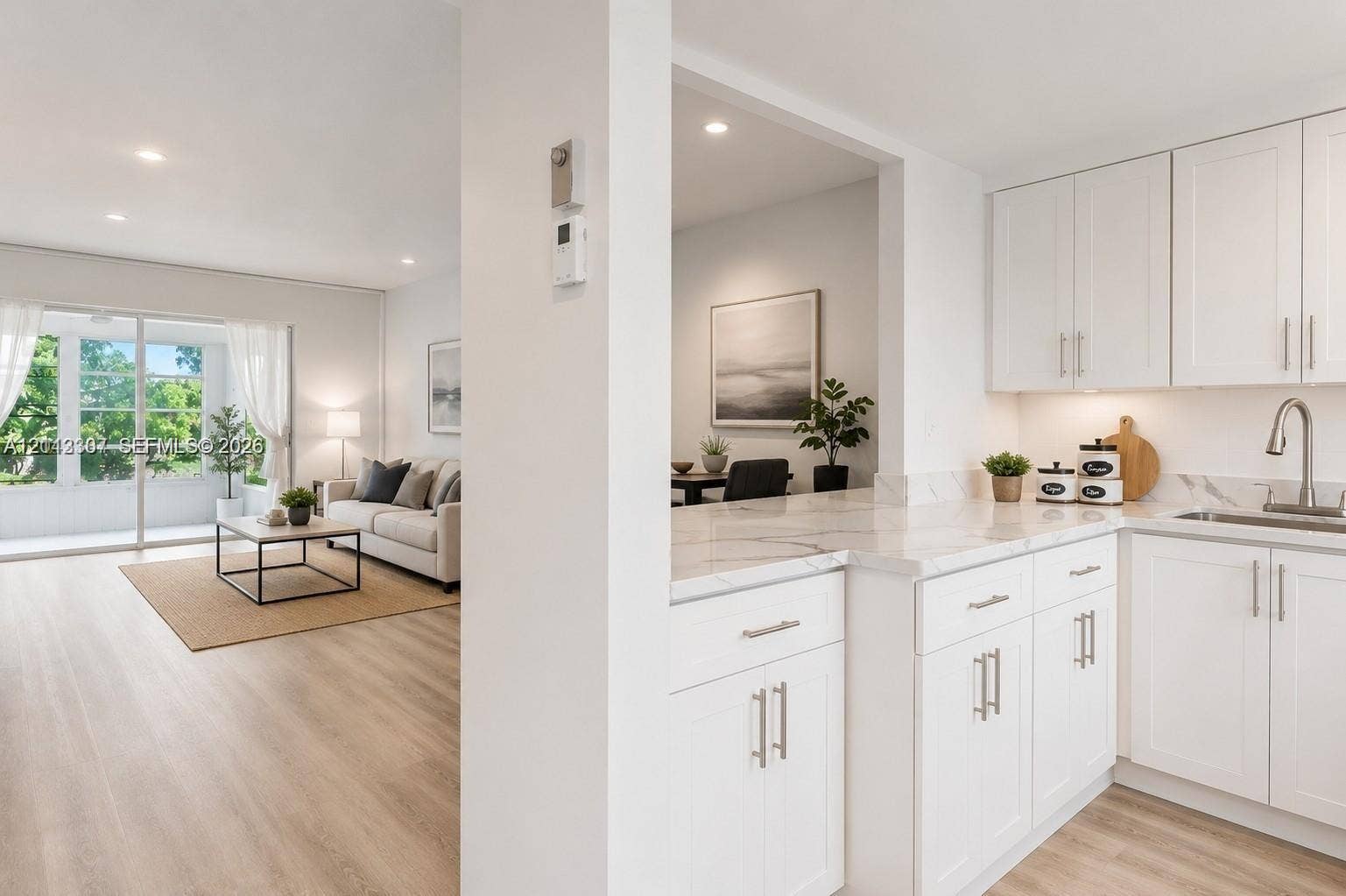 7605 NW 5th Place, #103, Margate, Margate, FL 33063 Kitchen featuring white Shaker-style cabinetry, stone-finish countertops, recessed lighting, and wood-finish flooring