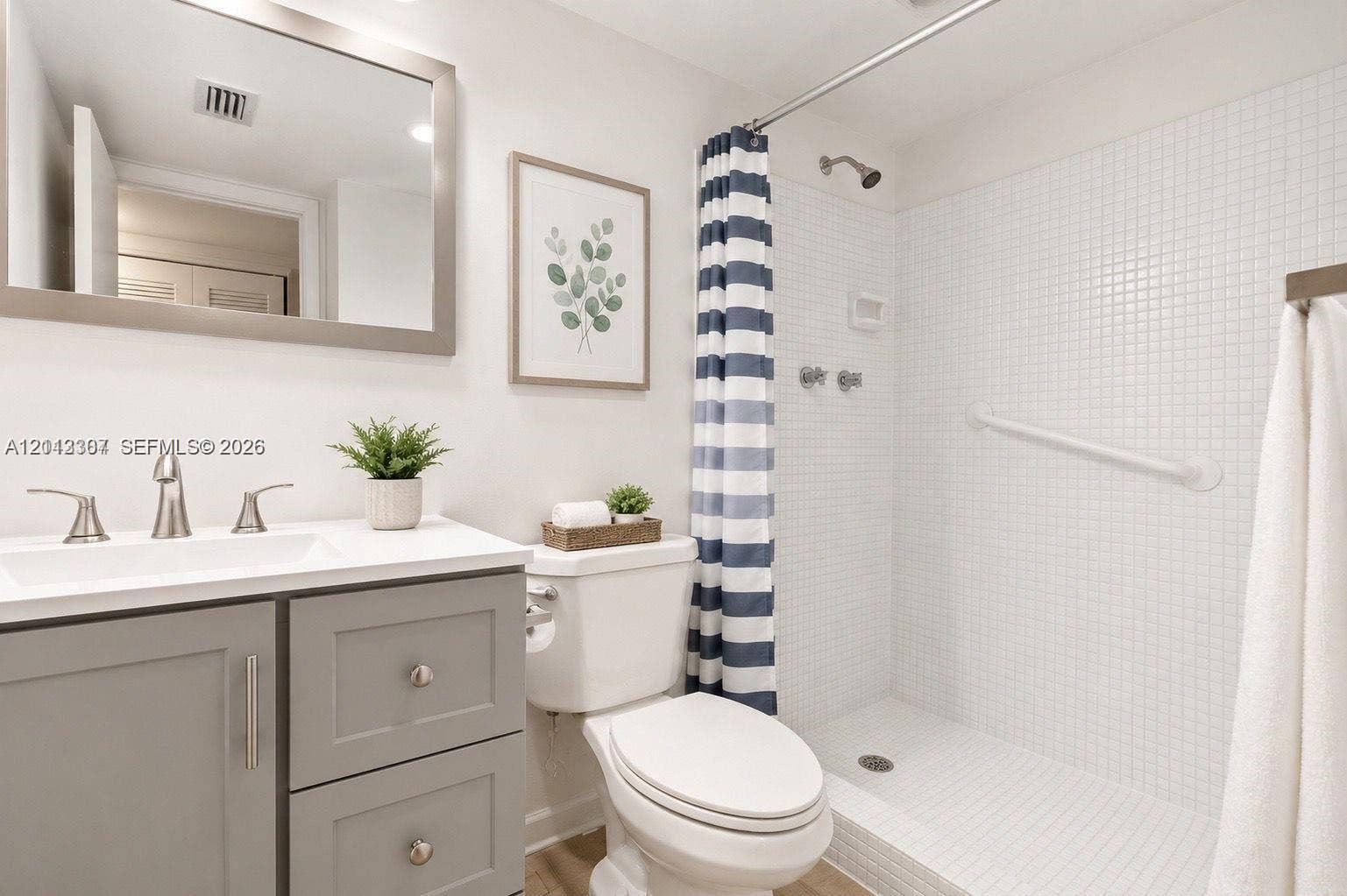 7605 NW 5th Place, #103, Margate, Margate, FL 33063 Bathroom featuring a vanity with grey cabinetry, white countertop, rectangular sink, and polished metal faucet