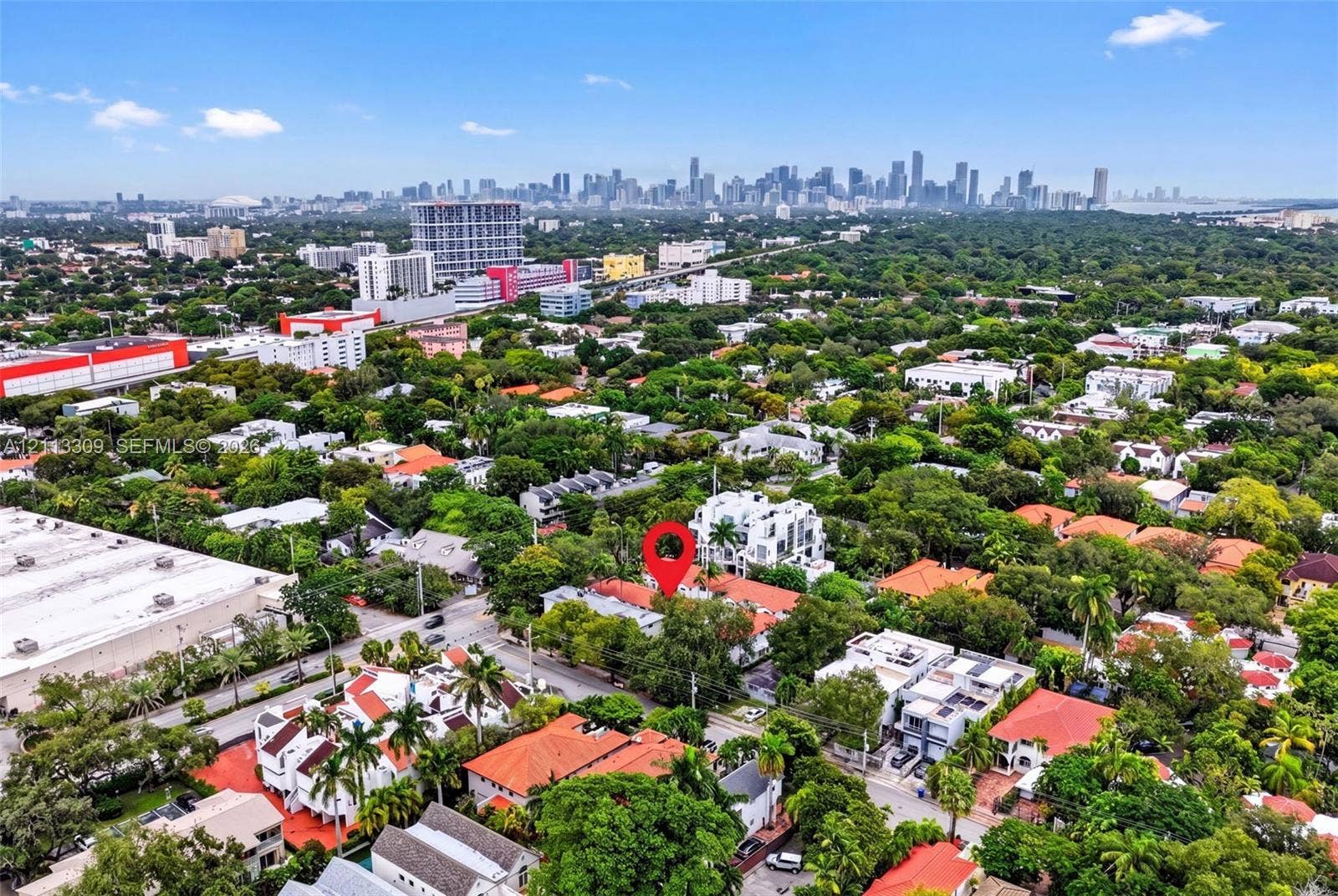 3082 Bird Avenue, #6, Miami, FL 33133 Aerial perspective showcasing a mature, tree-lined neighborhood with expansive urban skyline scenery