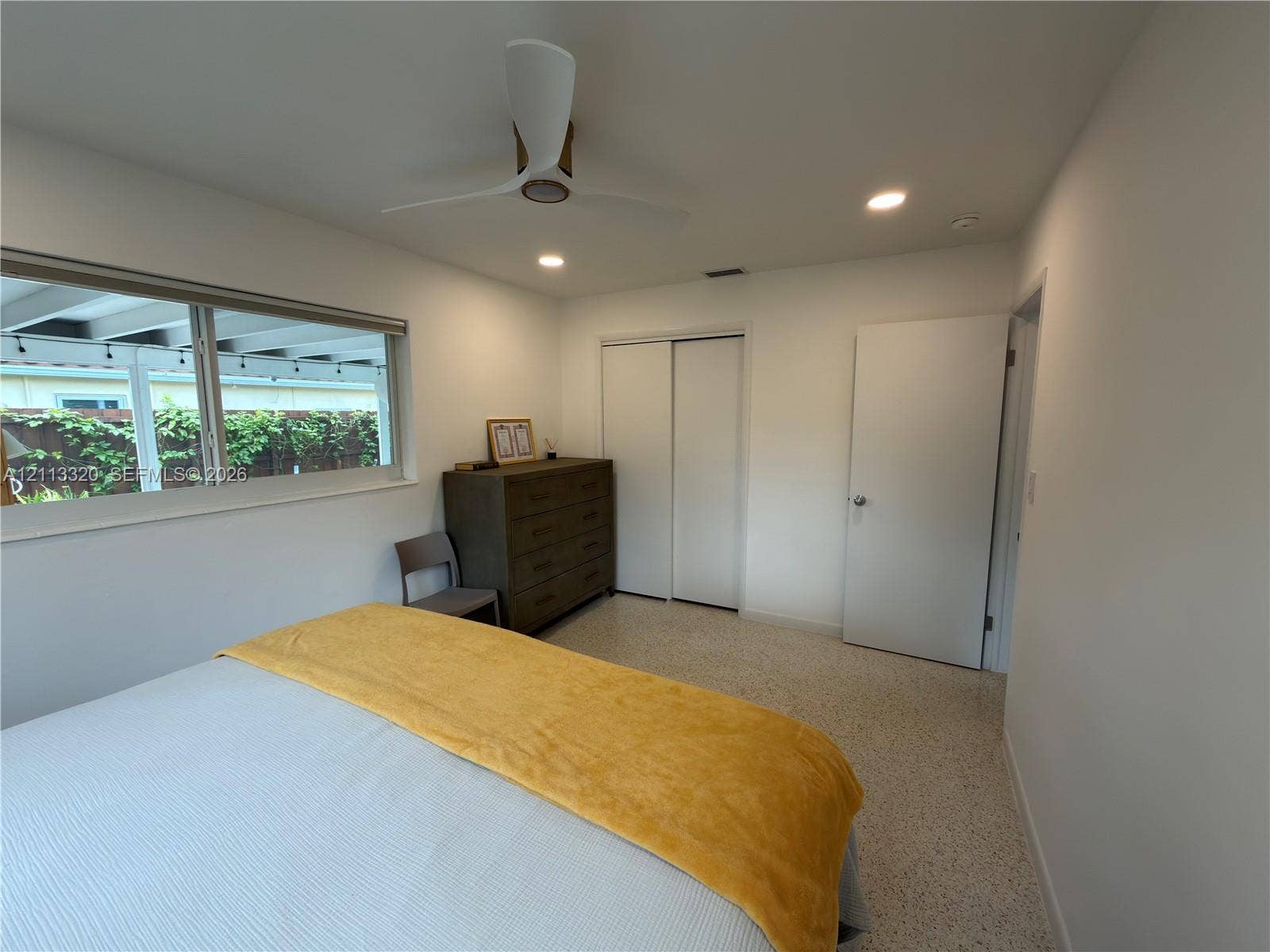 712 NE 25th Avenue, Pompano Beach, FL 33062 Interior space featuring recessed lighting, a three-blade ceiling fan, terrazzo flooring, and a sliding-door closet