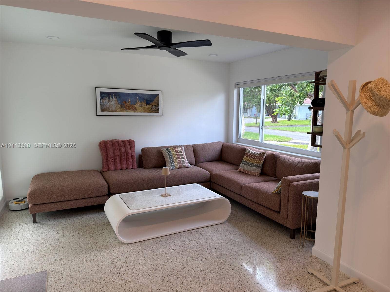 712 NE 25th Avenue, Pompano Beach, FL 33062 Living area featuring terrazzo flooring, large picture window, recessed lighting, and matte black ceiling fan