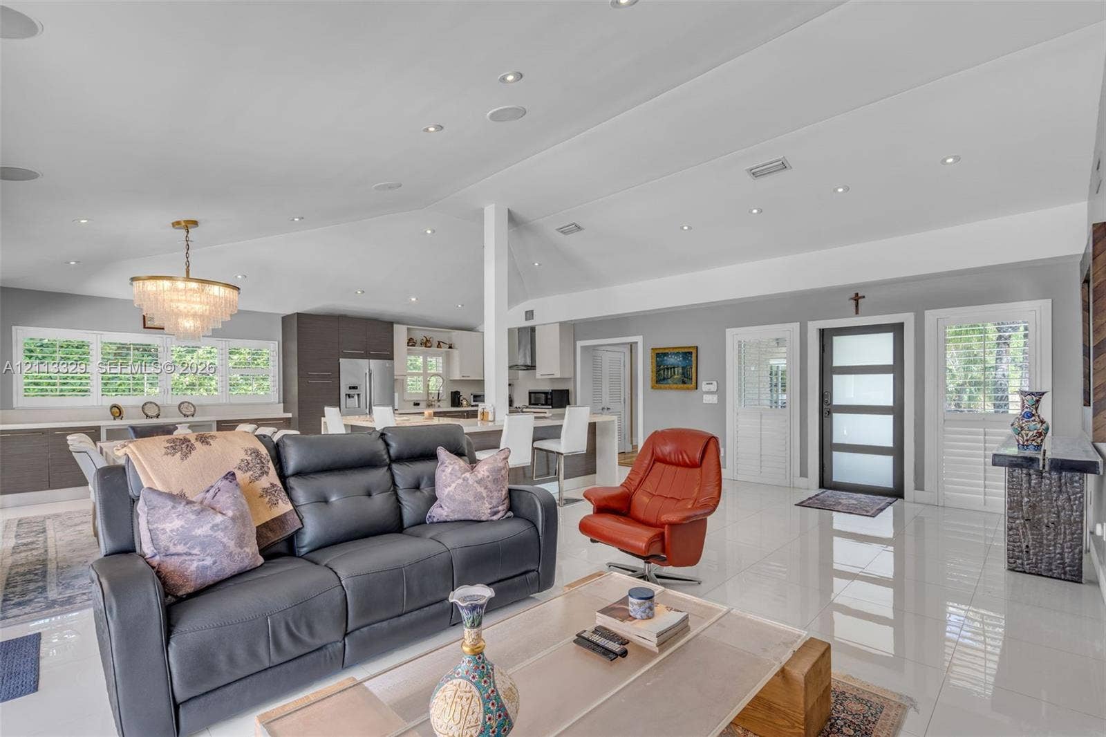 6440 SW 144th Street, Coral Gables, FL 33158 Vaulted ceilings with recessed lighting, tile flooring, tiered crystal chandelier, and exterior door with frosted glass panels