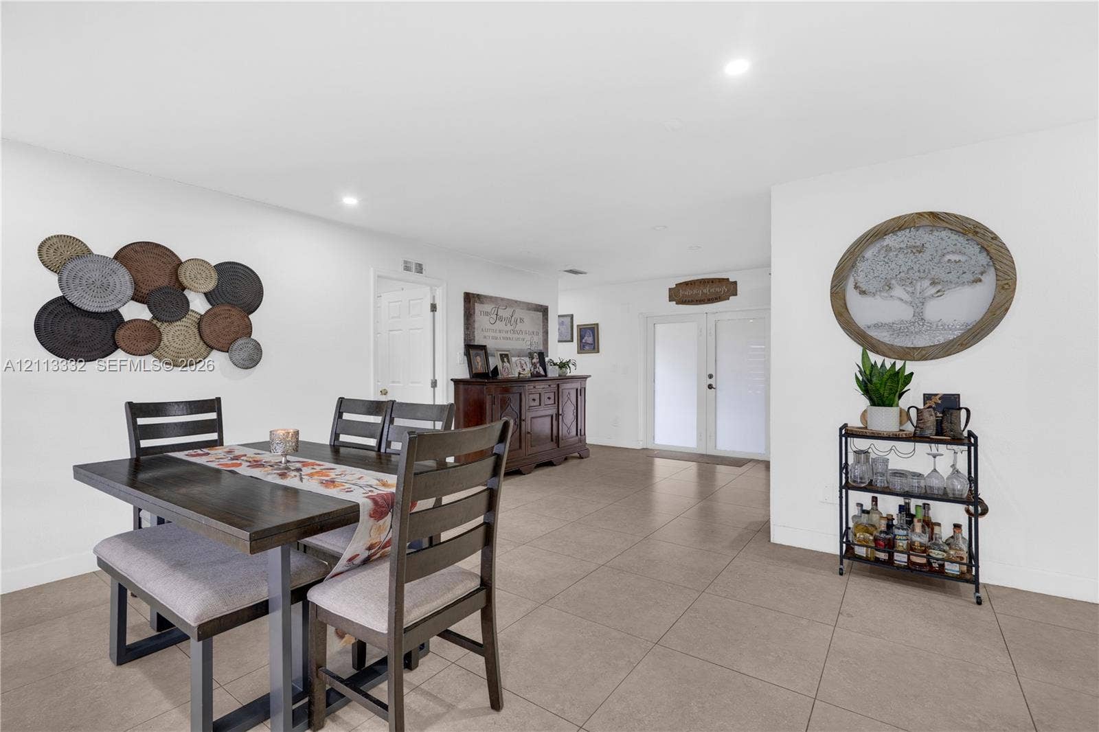 13111 SW 84th Street, Miami, FL 33183 Open-concept floor plan featuring large-format tile flooring and recessed lighting
