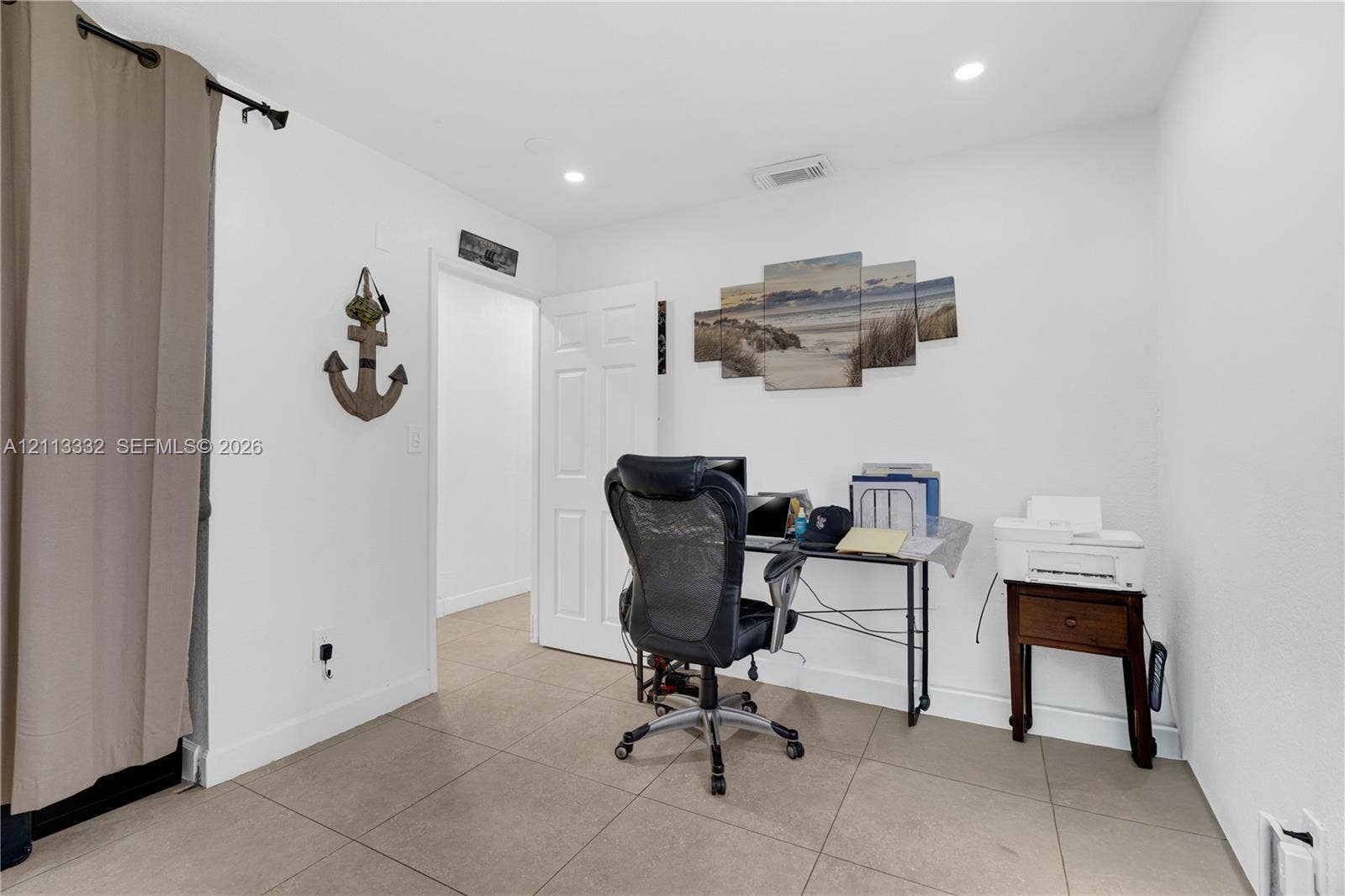 13111 SW 84th Street, Miami, FL 33183 Neutral wall paint, large-format tile flooring, and recessed ceiling lighting