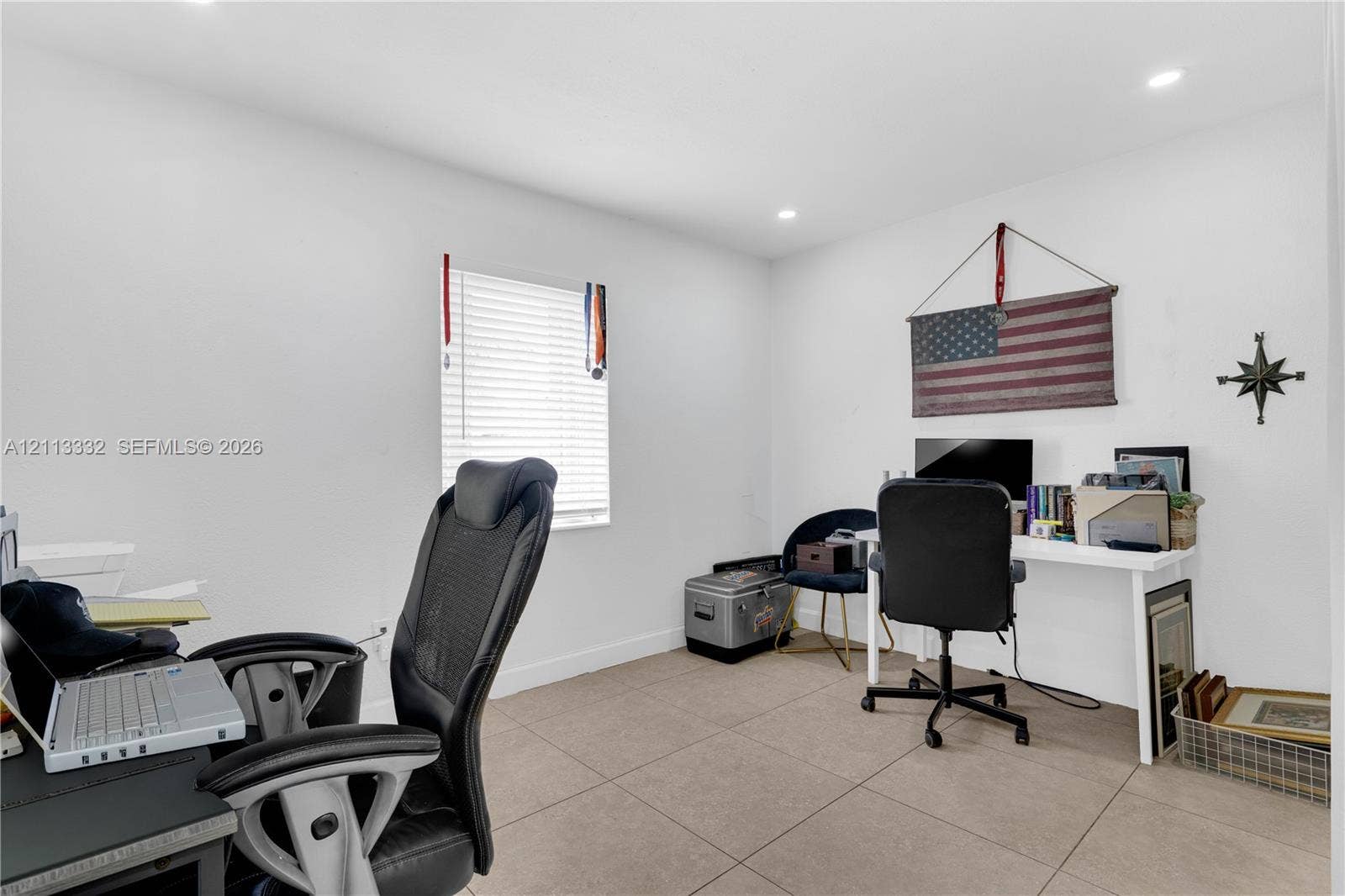 13111 SW 84th Street, Miami, FL 33183 Neutral-toned tile flooring, recessed ceiling lighting, and a window with horizontal blinds