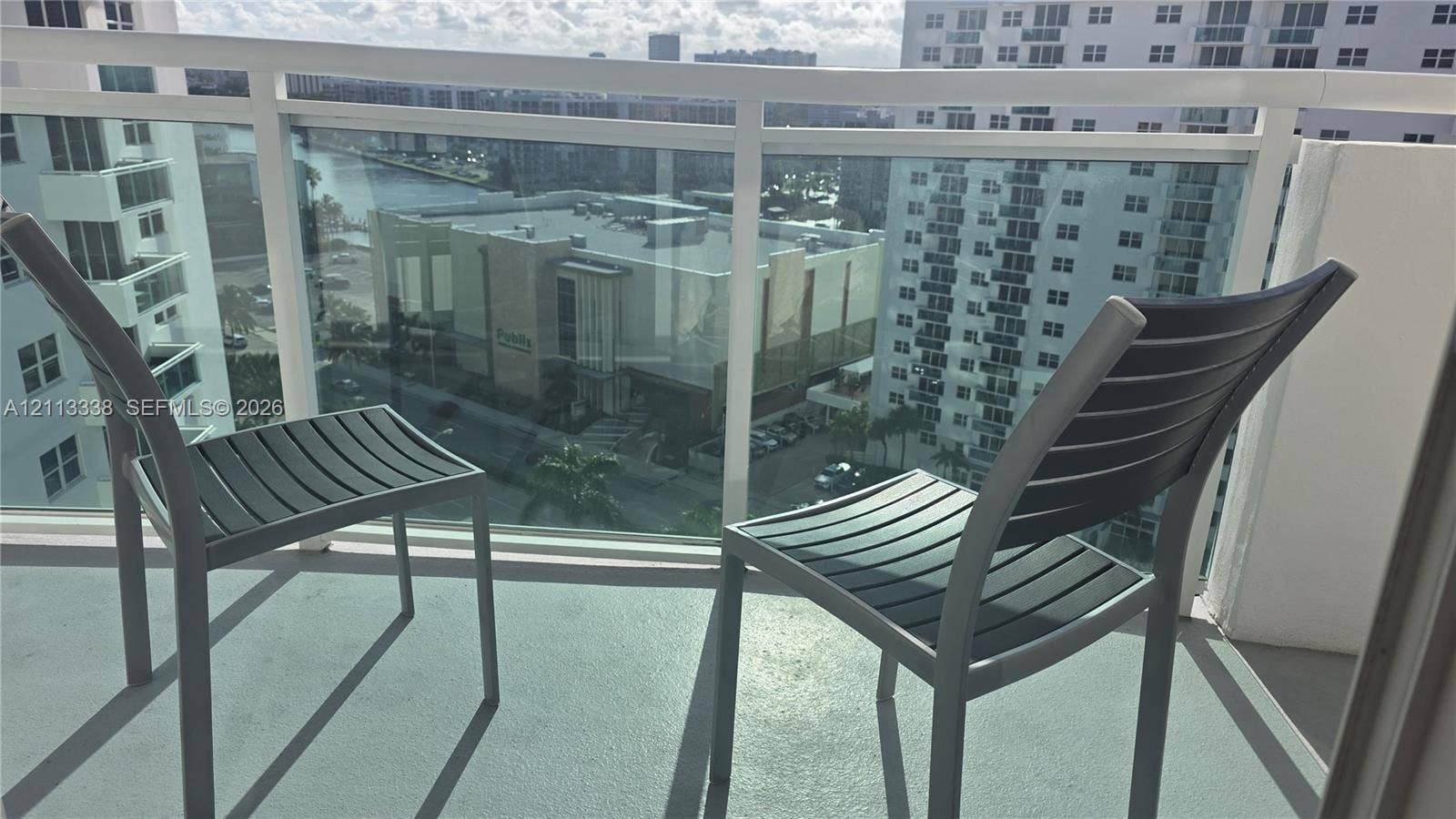 3001 S Ocean Drive, #1539, Hollywood, Hollywood, FL 33019 Private balcony featuring a glass panel railing and a concrete surface