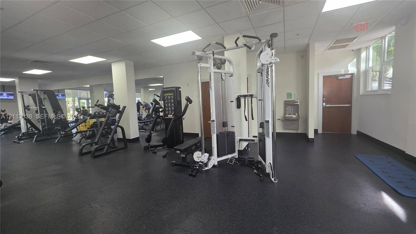 3001 S Ocean Drive, #1539, Hollywood, Hollywood, FL 33019 Fitness facility featuring resilient rubber flooring, inset ceiling lighting, wall-to-wall mirrors, and a wall-mounted water fountain