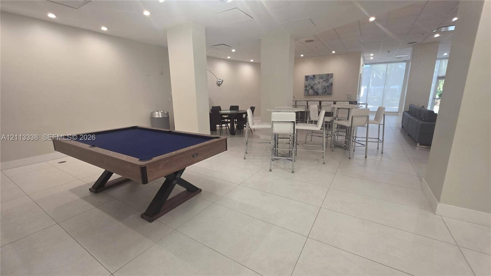 3001 S Ocean Drive, #1539, Hollywood, Hollywood, FL 33019 Large common area featuring tile flooring, recessed ceiling lighting, structural support columns, and expansive windows