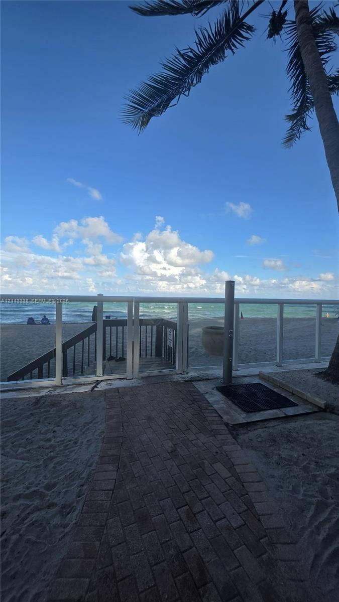 3001 S Ocean Drive, #1539, Hollywood, Hollywood, FL 33019 Brick paver walkway featuring an outdoor shower station and white aluminum railing with stairs