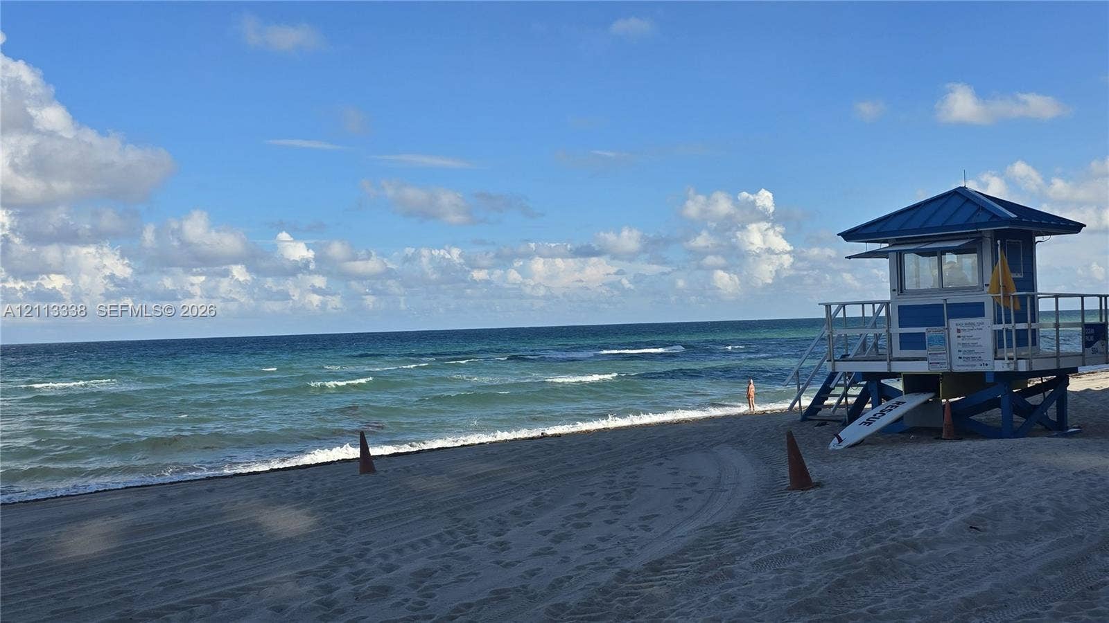 3001 S Ocean Drive, #1539, Hollywood, Hollywood, FL 33019 Sandy shoreline featuring direct ocean access and a permanent lifeguard station with a metal roof