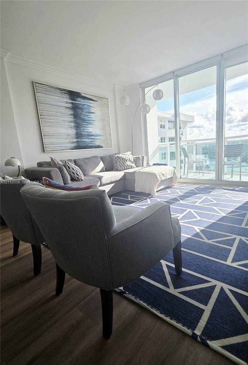 3001 S Ocean Drive, #1539, Hollywood, Hollywood, FL 33019 Floor-to-ceiling glass panel windows, wood-finish flooring, crown molding, and private balcony access