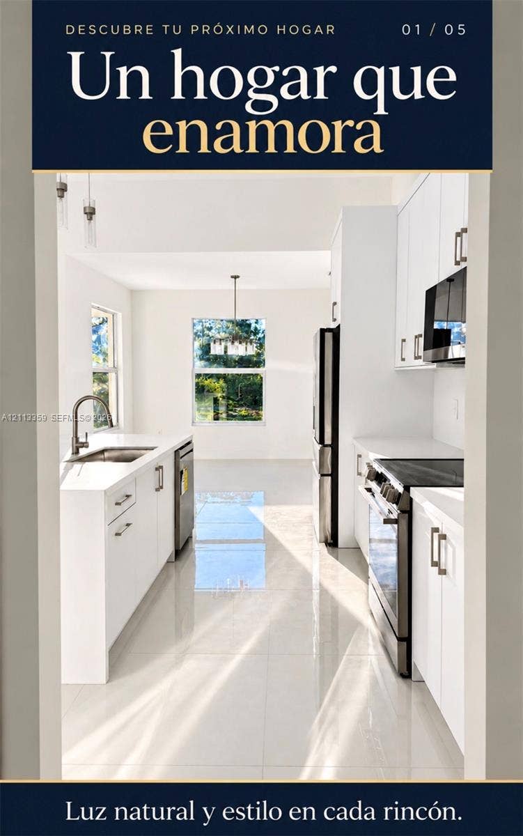 Kitchen featuring crisp white cabinetry, stainless steel appliances, polished tile flooring, and a single-basin undermount sink with a gooseneck faucet
