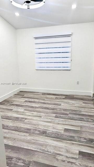 9395 Boca River Circle, Boca Raton, Boca Raton, FL 33434 Floating wood-finish vanity with dual vessel sinks, quartz countertop, large backlit mirror, and textured wall tile