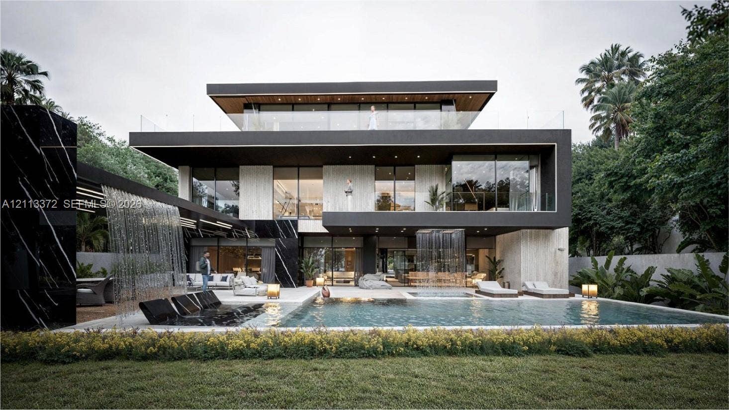 3312 NE 16th Court, Fort Lauderdale, FL 33305 Modern multi-level exterior featuring floor-to-ceiling glass paneling, stone facade cladding, cantilevered rooflines, integrated waterfall features, and an inground swimming pool with a stone deck