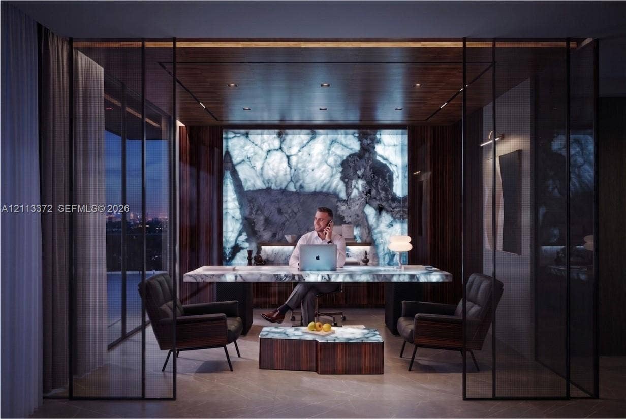 3312 NE 16th Court, Fort Lauderdale, FL 33305 Office featuring floor-to-ceiling glass panel walls, a backlit stone feature wall, a built-in stone-top desk, wood-paneled ceiling with recessed lighting, and stone flooring