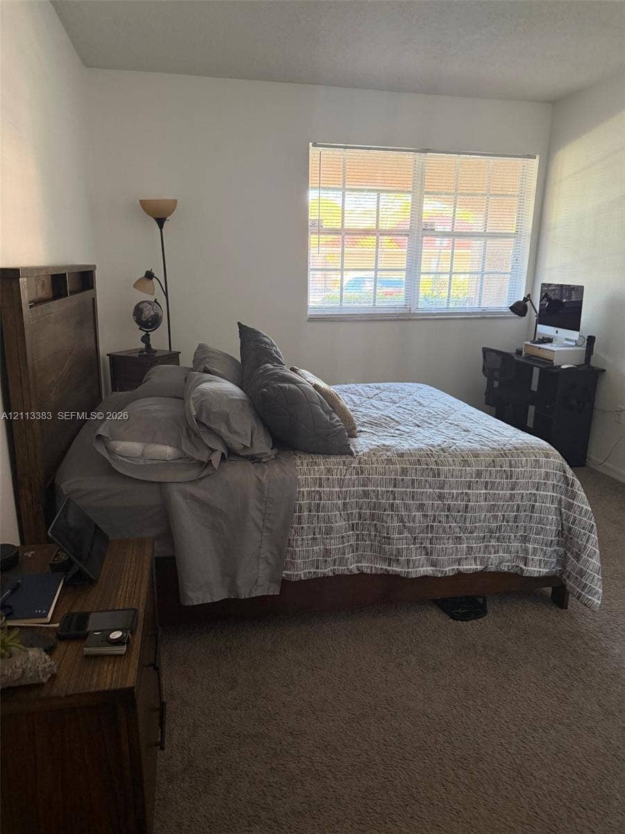 200 SW 117th Terrace, #10103, Pembroke Pines, FL 33025 Neutral-toned carpet flooring and a multi-pane window with integrated grid detailing