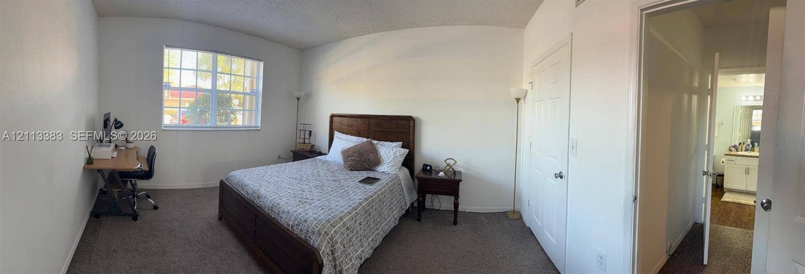 200 SW 117th Terrace, #10103, Pembroke Pines, FL 33025 Room featuring neutral-toned carpeting, multi-pane window, and white interior doors