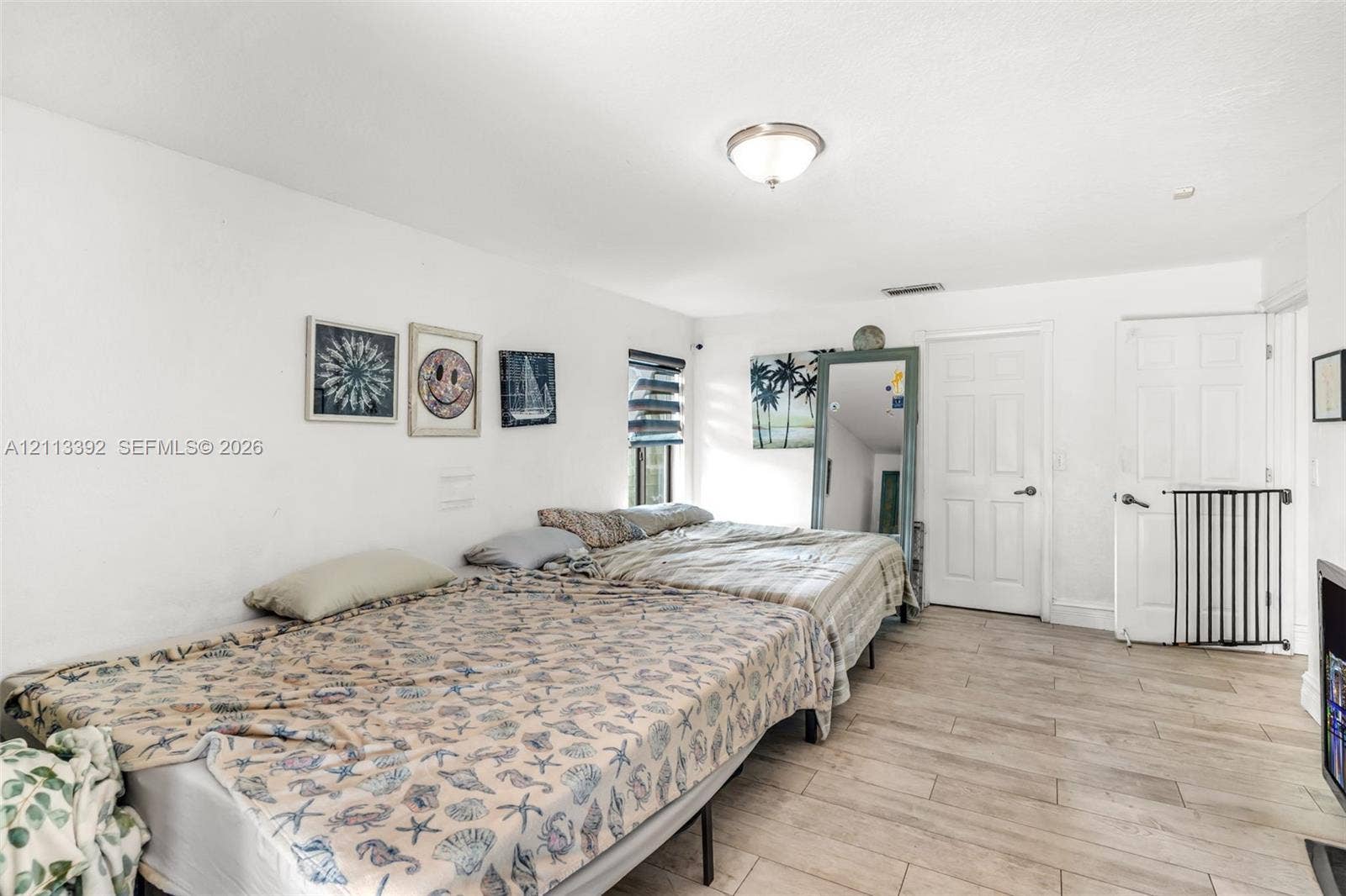 10705 SW 134th Court, Miami, FL 33186 Neutral-toned tile flooring, flush-mount ceiling lighting, and solid-core interior doors