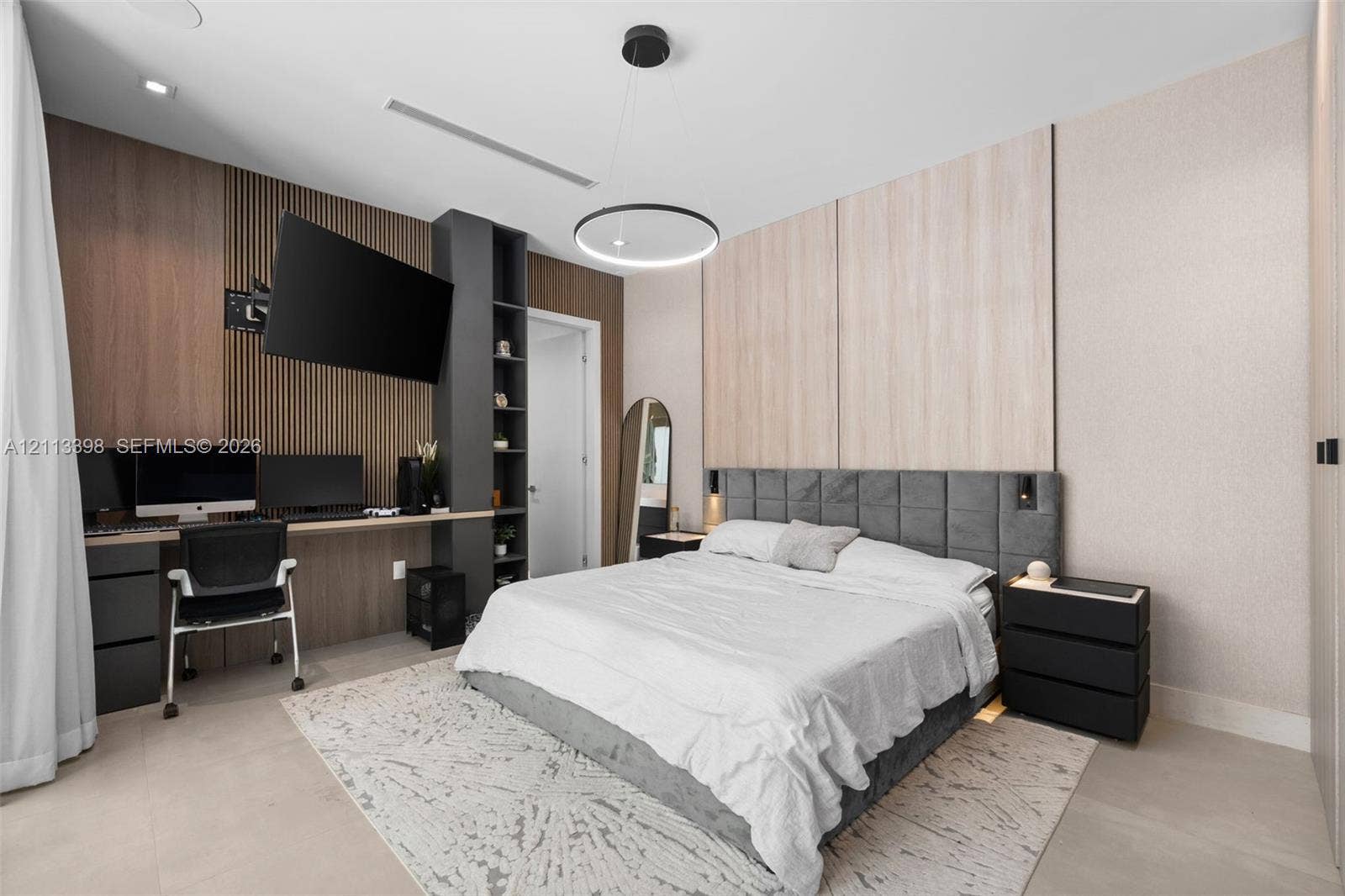 6814 NW 104th Court, #6814, Doral, Doral, FL 33178 Custom built-in wood-slat desk station with integrated shelving, recessed ceiling lighting, circular pendant light fixture, and dual-tone wall paneling