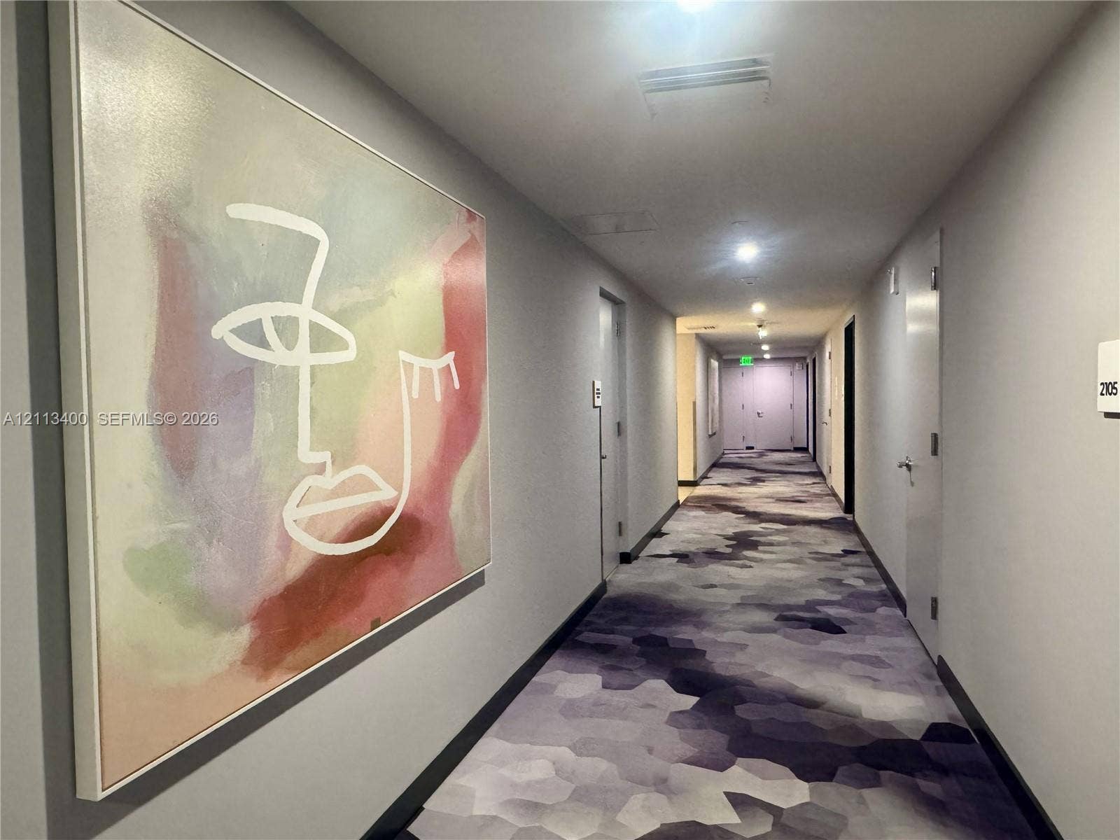 227 NE 2nd Street, #2105, Miami, FL 33132 Hallway featuring patterned wall-to-wall carpeting, neutral painted walls, and recessed lighting