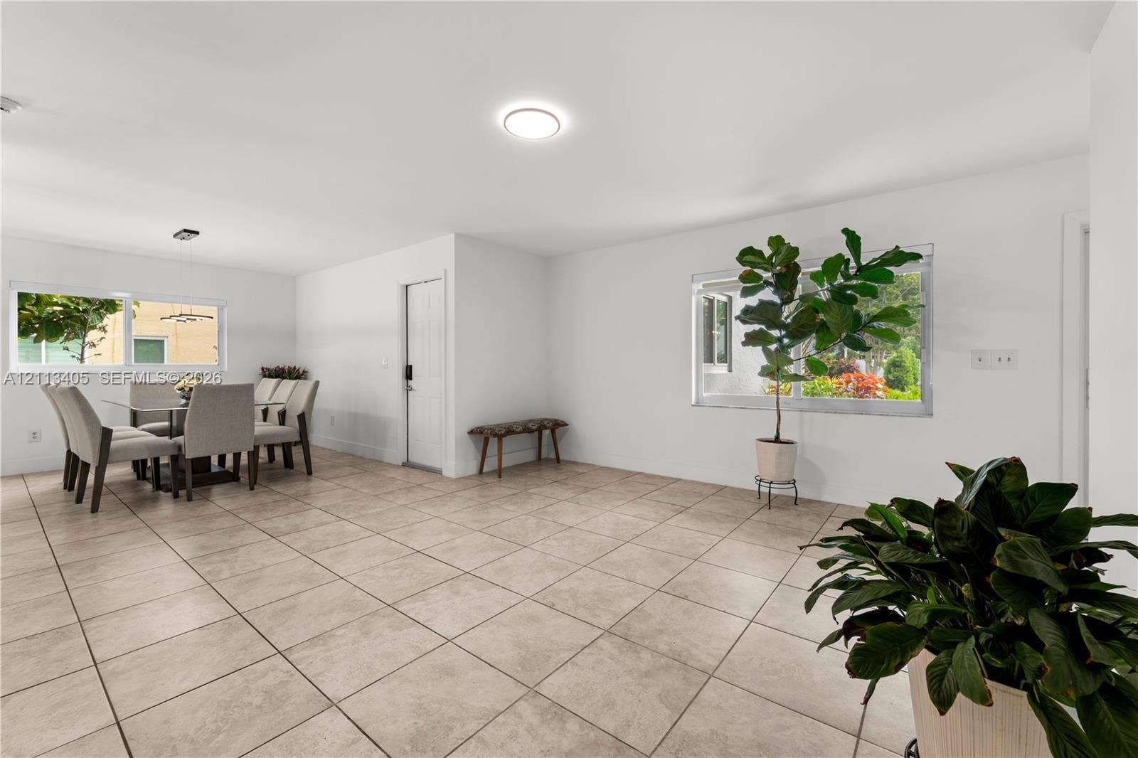 1675 S Goldeneye Lane, Homestead, FL 33035 Neutral-toned tile flooring, recessed ceiling lighting, and horizontal sliding windows