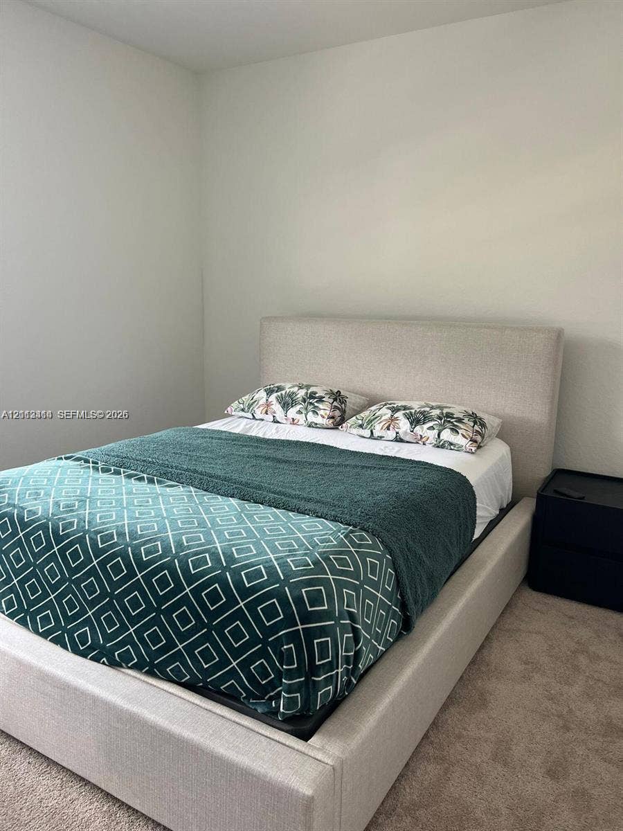 3024 Green Palm Court, #5838, Dania, Dania Beach, FL 33312 Neutral-toned interior space featuring light-colored wall paint and carpeted flooring