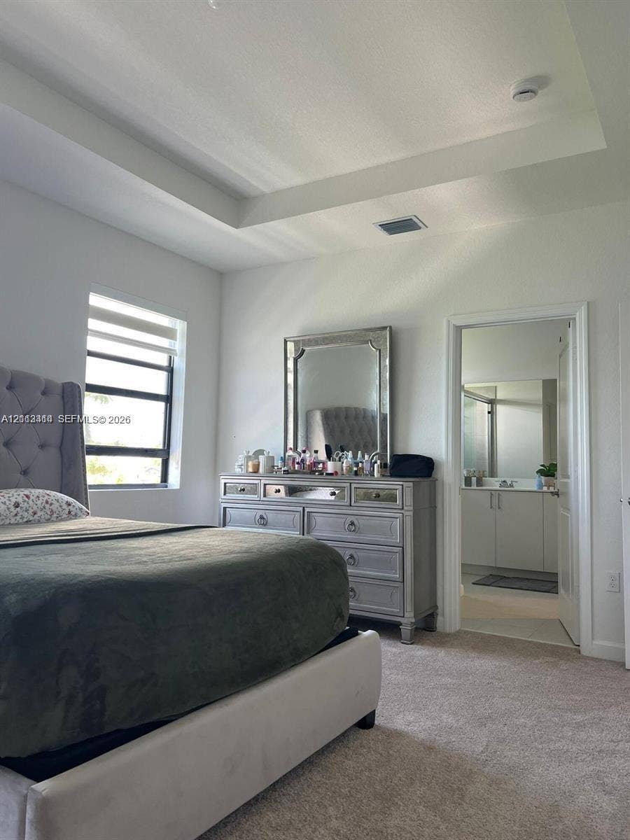 3024 Green Palm Court, #5838, Dania, Dania Beach, FL 33312 Tray ceiling, neutral carpeting, and window with horizontal blinds