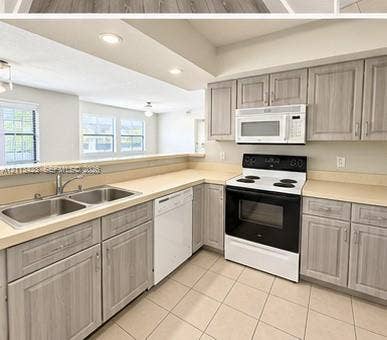 10360 SW 150th Court, #12207, Miami, Miami, FL 33196 Kitchen featuring wood-finish cabinetry, neutral solid-surface countertops, recessed lighting, and tile flooring