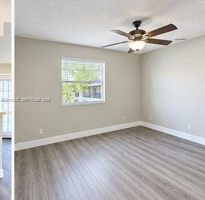 10360 SW 150th Court, #12207, Miami, Miami, FL 33196 Room interior featuring wood-finish flooring, a ceiling fan with integrated lighting, and horizontal blinds installed on a window