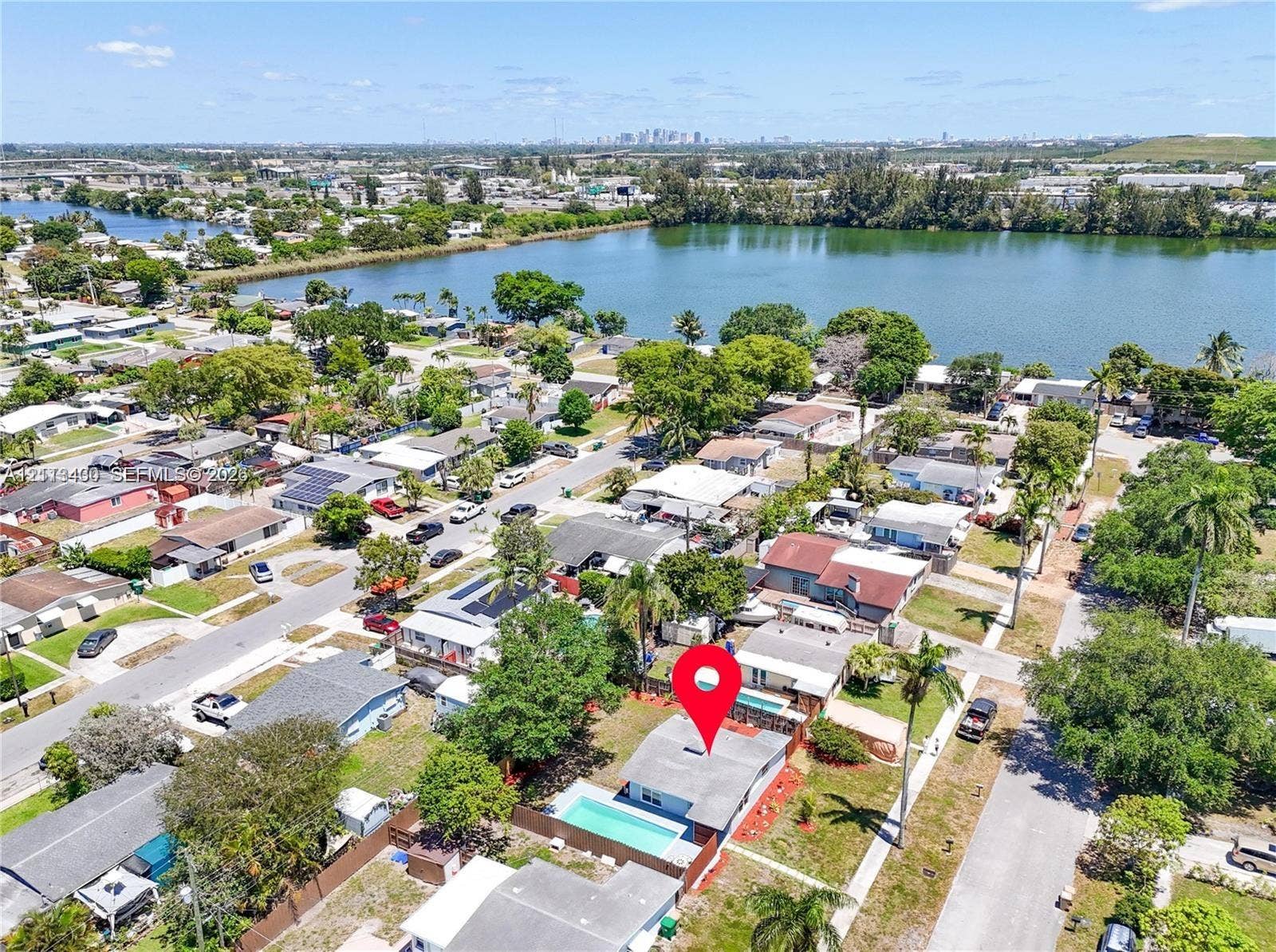 5621 SW 38th Court, Davie, Davie, FL 33314 Single-story residence featuring an in-ground swimming pool, fenced perimeter, and established landscaping