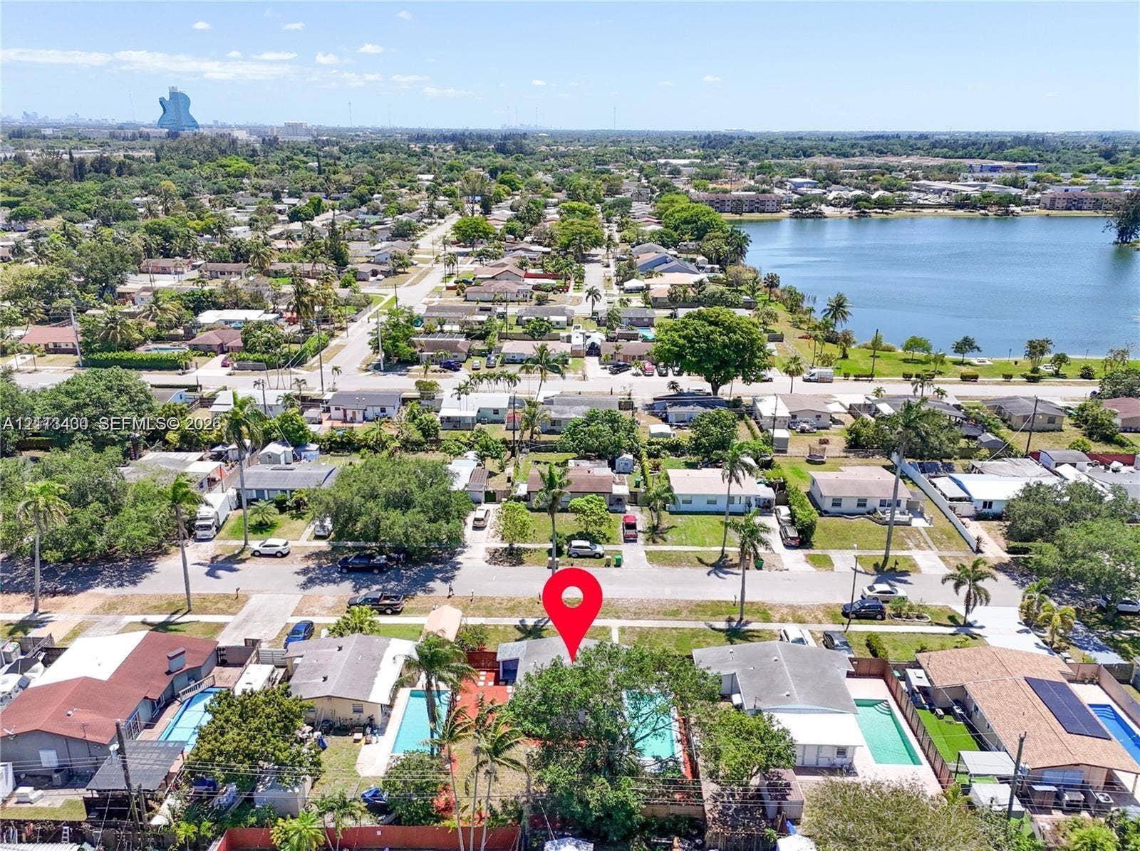 5621 SW 38th Court, Davie, Davie, FL 33314 Aerial perspective of residential property featuring a private swimming pool, fenced perimeter, and mature canopy trees