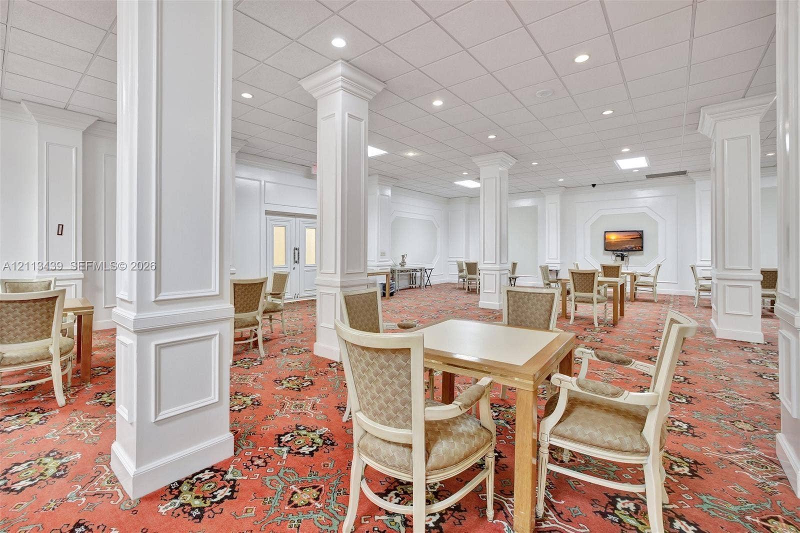 3800 S Ocean Drive, #416, Hollywood, FL 33019 Large open interior space featuring white decorative columns, recessed lighting, drop ceiling, and wall molding
