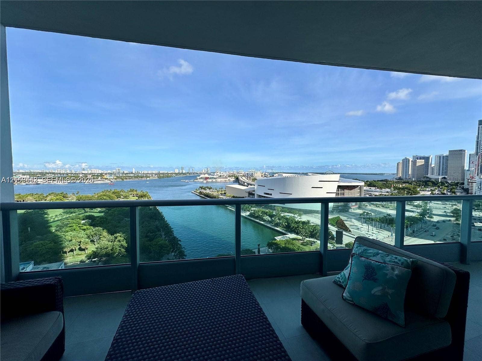 900 Biscayne Boulevard, #1903, Miami, Miami, FL 33132 Covered balcony with a glass and metal railing, concrete flooring, and water frontage