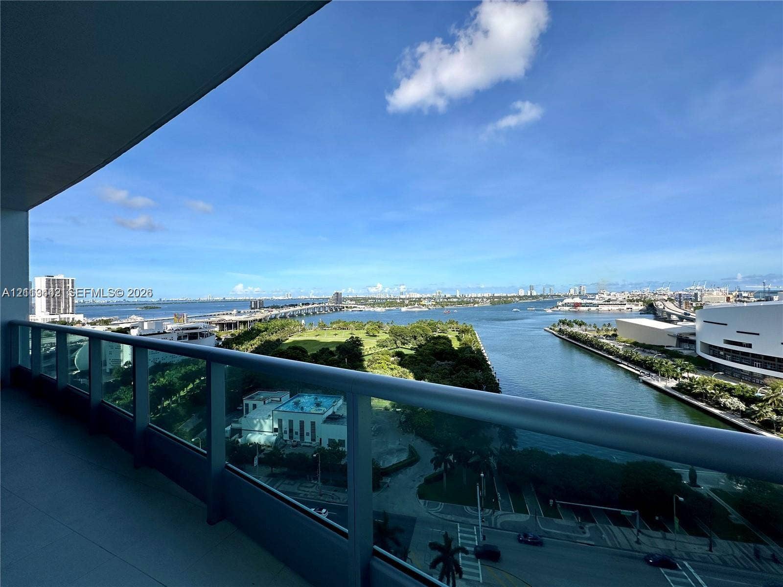 900 Biscayne Boulevard, #1903, Miami, Miami, FL 33132 Covered balcony with a glass and metal railing overlooking the waterfront and cityscape