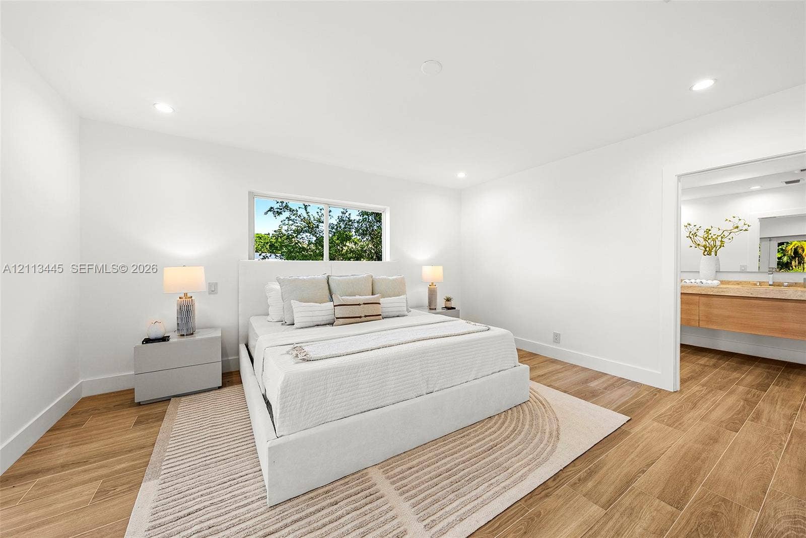 6951 SW 134th Street, Pinecrest, Pinecrest, FL 33156 Bedroom featuring recessed lighting, wood-finish flooring, and a window with exterior greenery