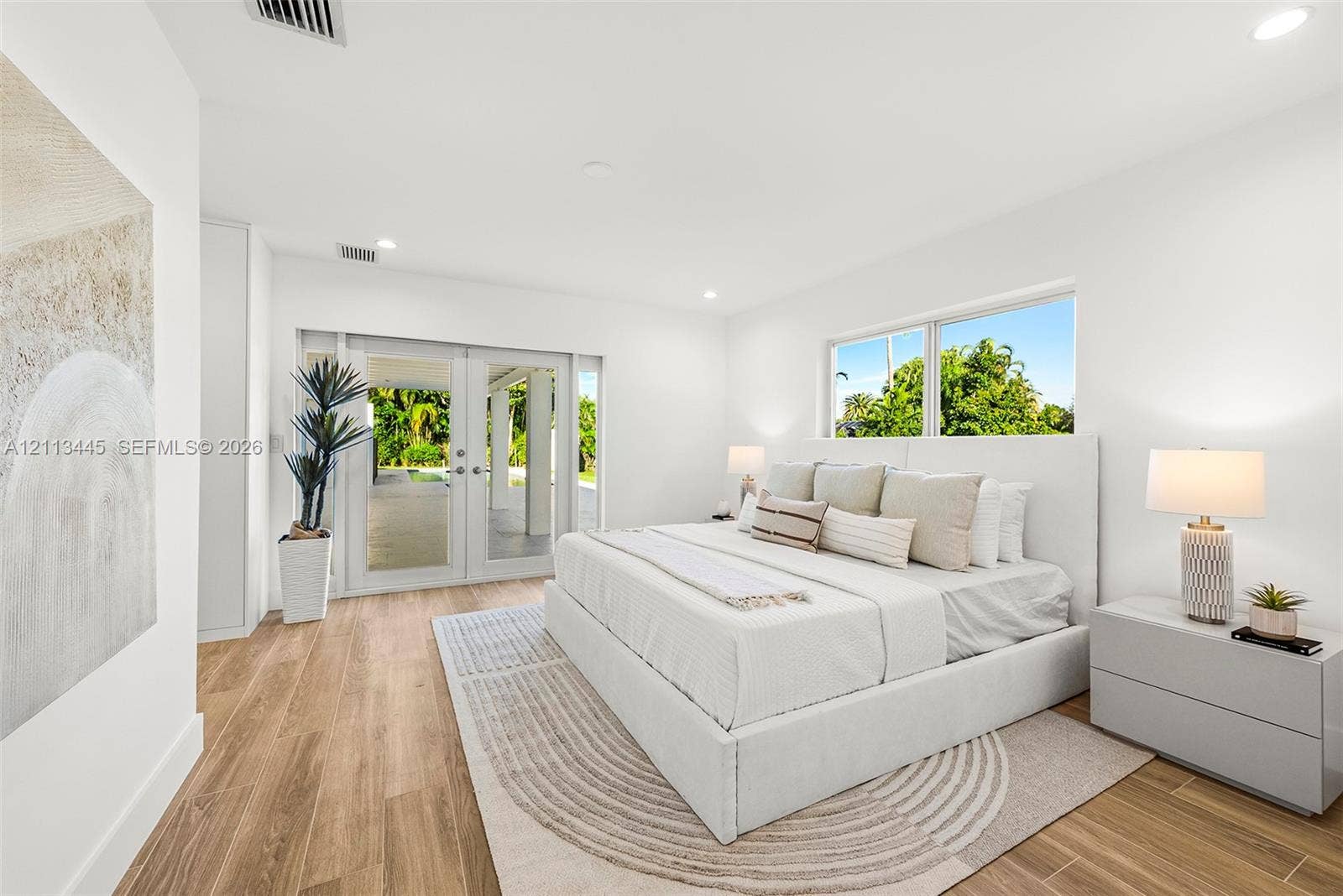 6951 SW 134th Street, Pinecrest, Pinecrest, FL 33156 Room featuring wood-finish flooring, recessed lighting, and glass-paned double doors