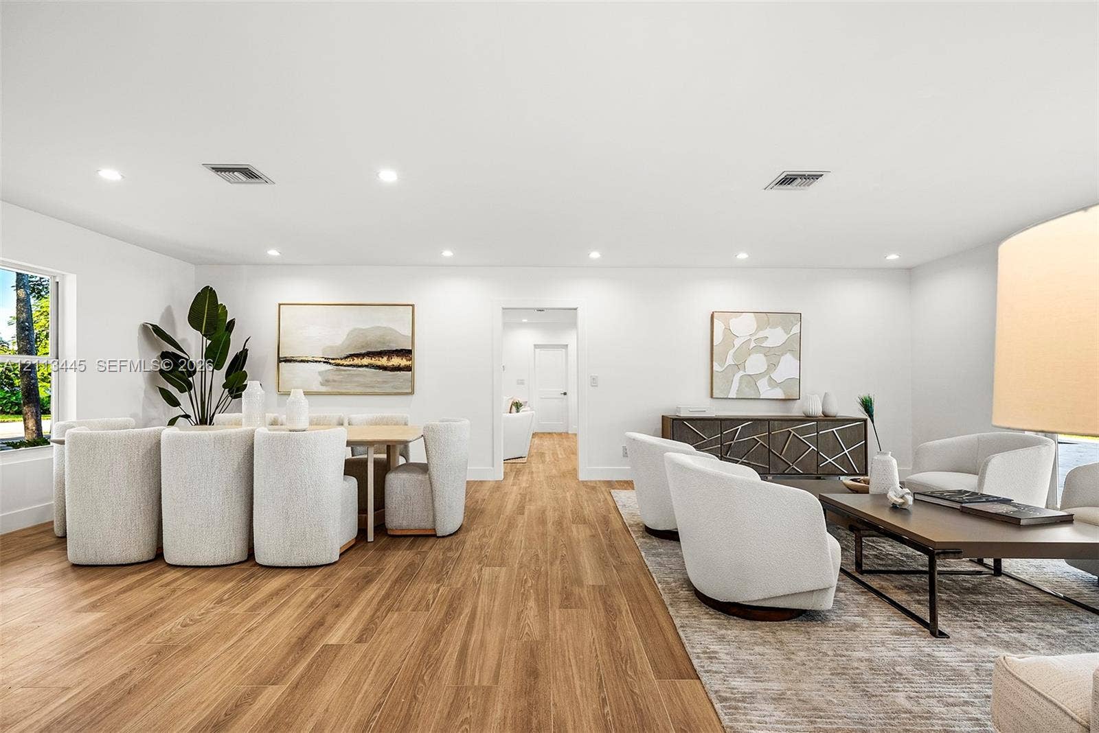 6951 SW 134th Street, Pinecrest, Pinecrest, FL 33156 Open-concept interior featuring wood-finish flooring, recessed lighting, and crisp white wall finishes