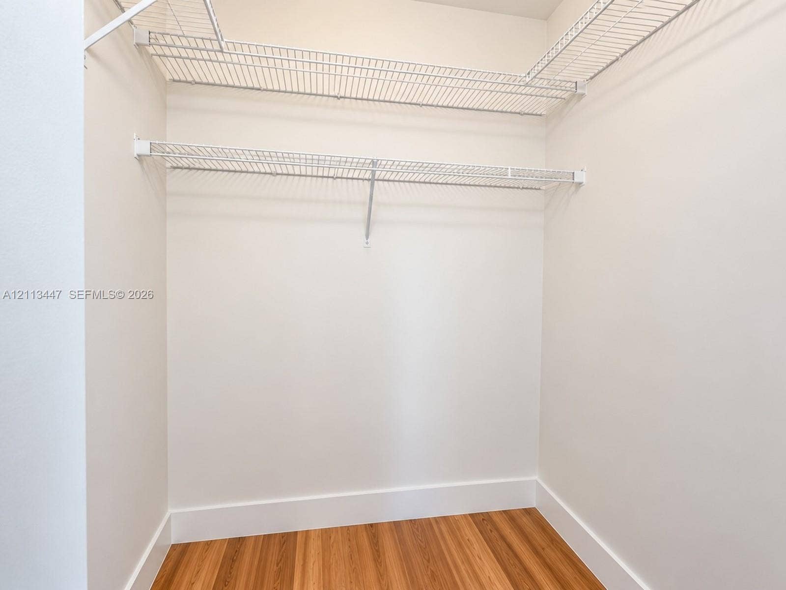 3818 San Simeon Circle, #3818, Weston, Weston, FL 33331 Walk-in closet featuring tiered white wire shelving and luxury laminate flooring
