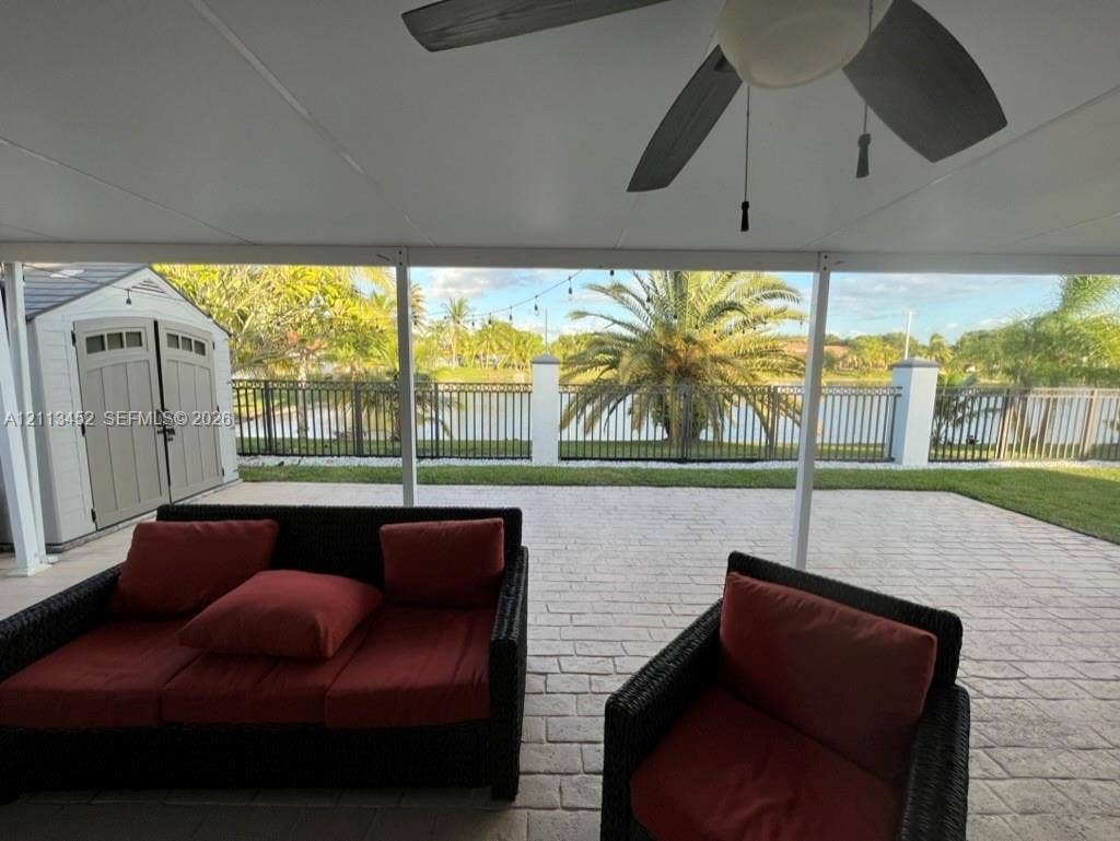 5083 SW 160th Avenue, Miami, Miami, FL 33185 Covered patio featuring a paver surface, ceiling fan, and metal perimeter fencing