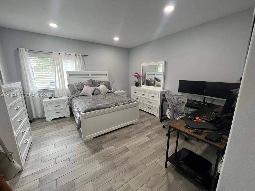 5083 SW 160th Avenue, Miami, Miami, FL 33185 Neutral-toned space featuring wood-finish tile flooring and recessed ceiling lighting