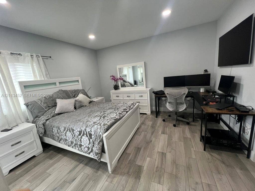 5083 SW 160th Avenue, Miami, Miami, FL 33185 Neutral-toned room featuring wood-finish flooring and recessed lighting