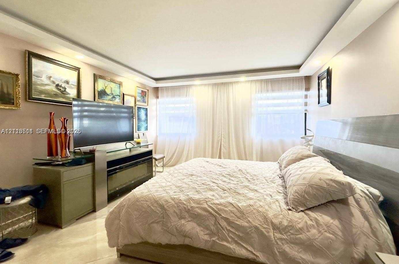 1201 S Ocean Drive, #2202S, Hollywood, FL 33019 Tray ceiling with recessed lighting and large-format tile flooring
