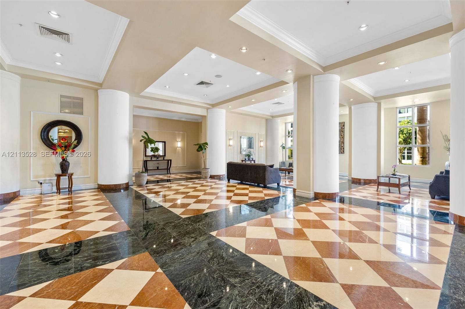 17555 Atlantic Boulevard, #1108, Sunny Isles Beach, Sunny Isles Beach, FL 33160 Grand foyer featuring geometric patterned stone flooring, recessed ceiling lighting, and structural circular columns