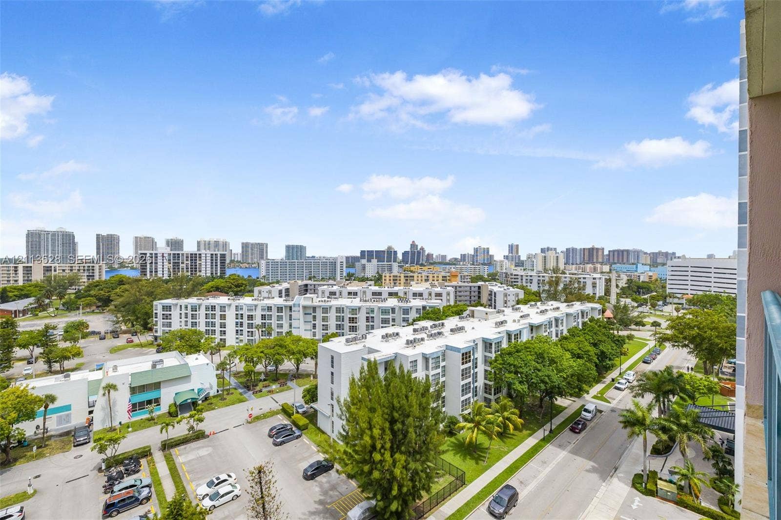 17555 Atlantic Boulevard, #1108, Sunny Isles Beach, Sunny Isles Beach, FL 33160 Elevated perspective featuring a panoramic urban skyline, high-rise architecture, and mature greenery
