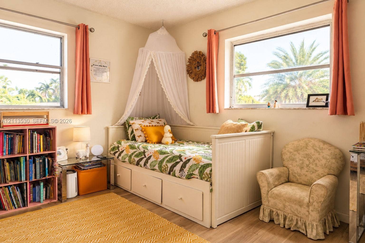 1773 NW 82nd Avenue, Coral Springs, FL 33071 Neutral-toned interior featuring wood-finish flooring, dual windows with metallic hardware, and natural light exposure