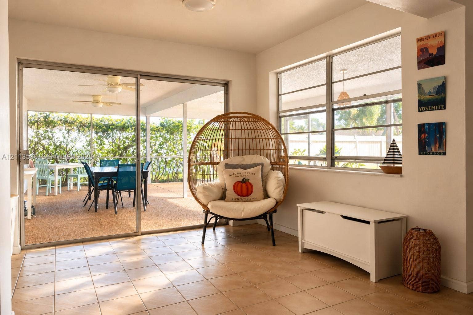 1773 NW 82nd Avenue, Coral Springs, FL 33071 Large ceramic floor tiling, expansive sliding glass doors, horizontal sliding windows, and a covered patio area with textured concrete surfacing