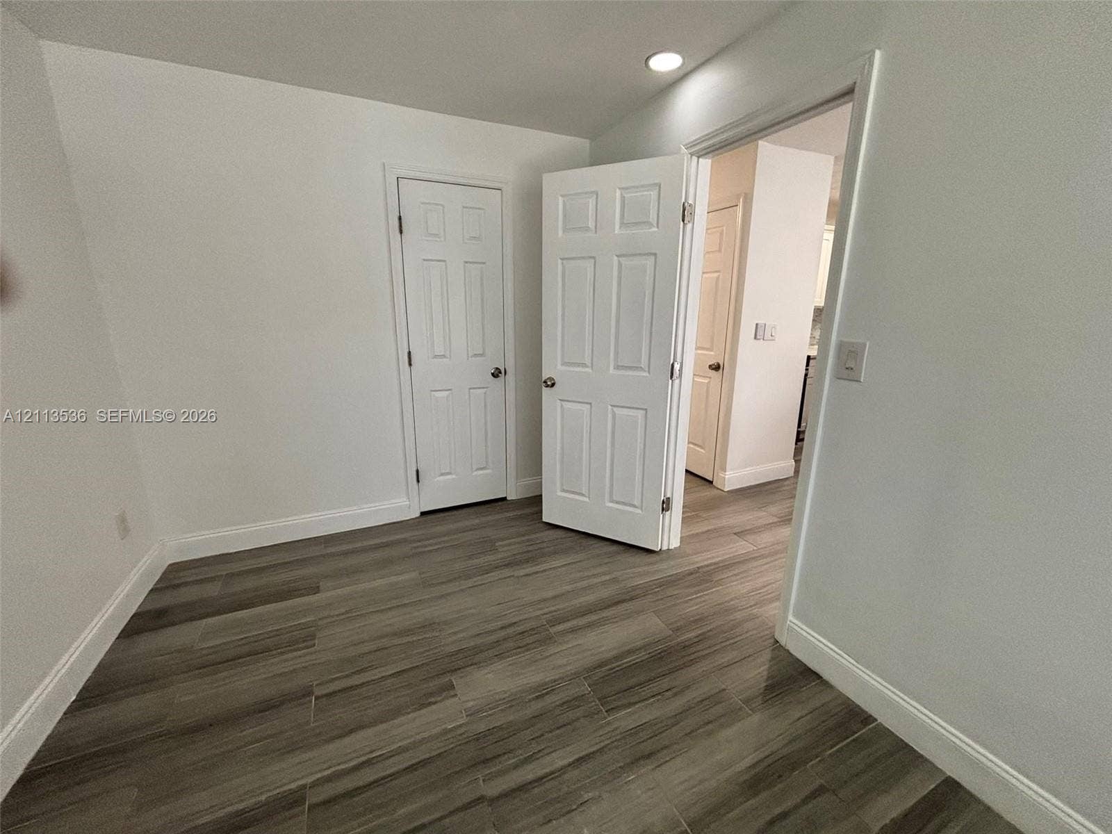 4840 SW 25th Avenue, #4840, Dania, Dania Beach, FL 33312 Wood-finish flooring, white six-panel interior doors, and recessed ceiling lighting