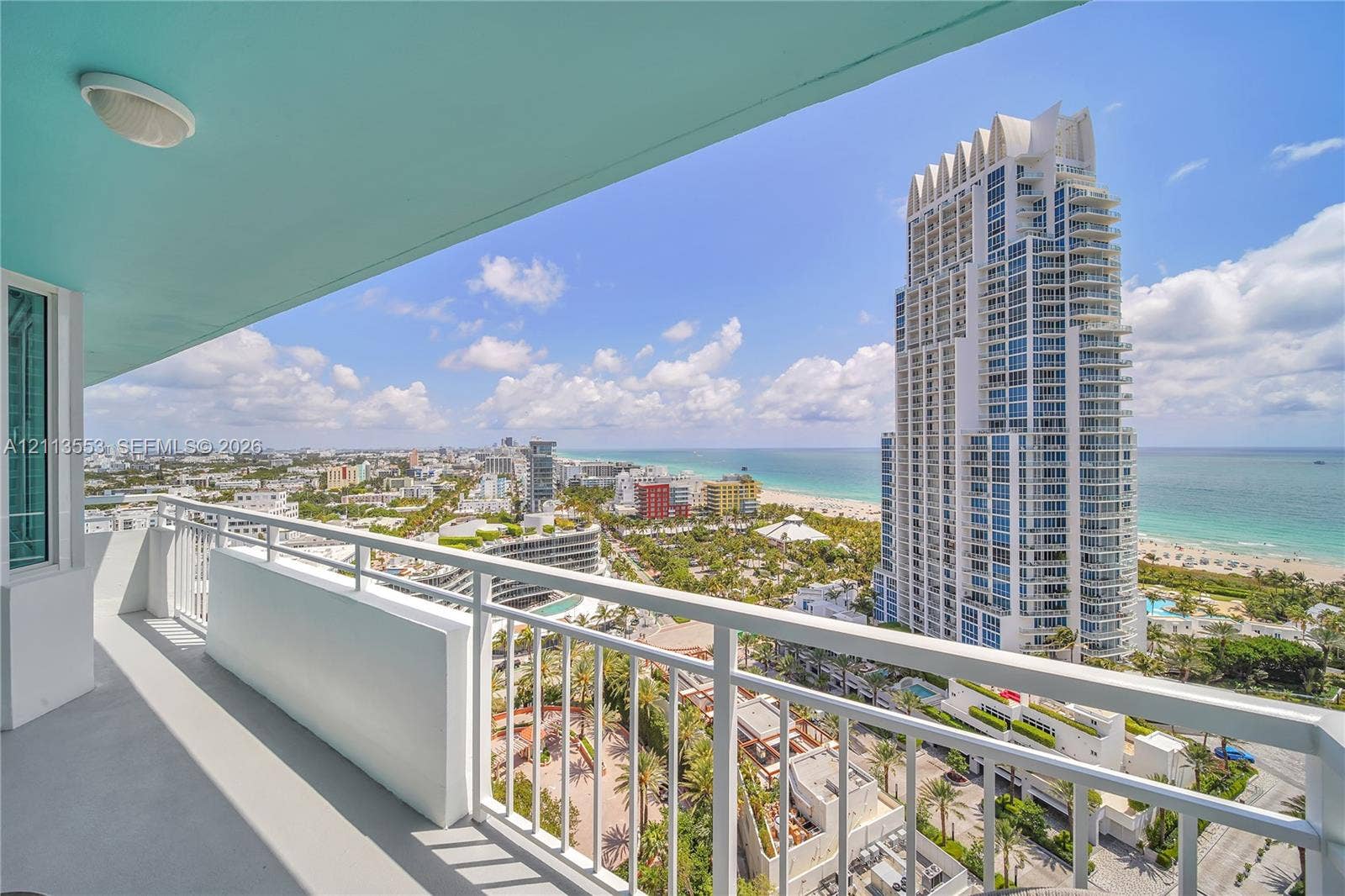 400 S Pointe Drive, #2106, Miami Beach, FL 33139 Covered balcony featuring white metal railings and a flush-mount ceiling light