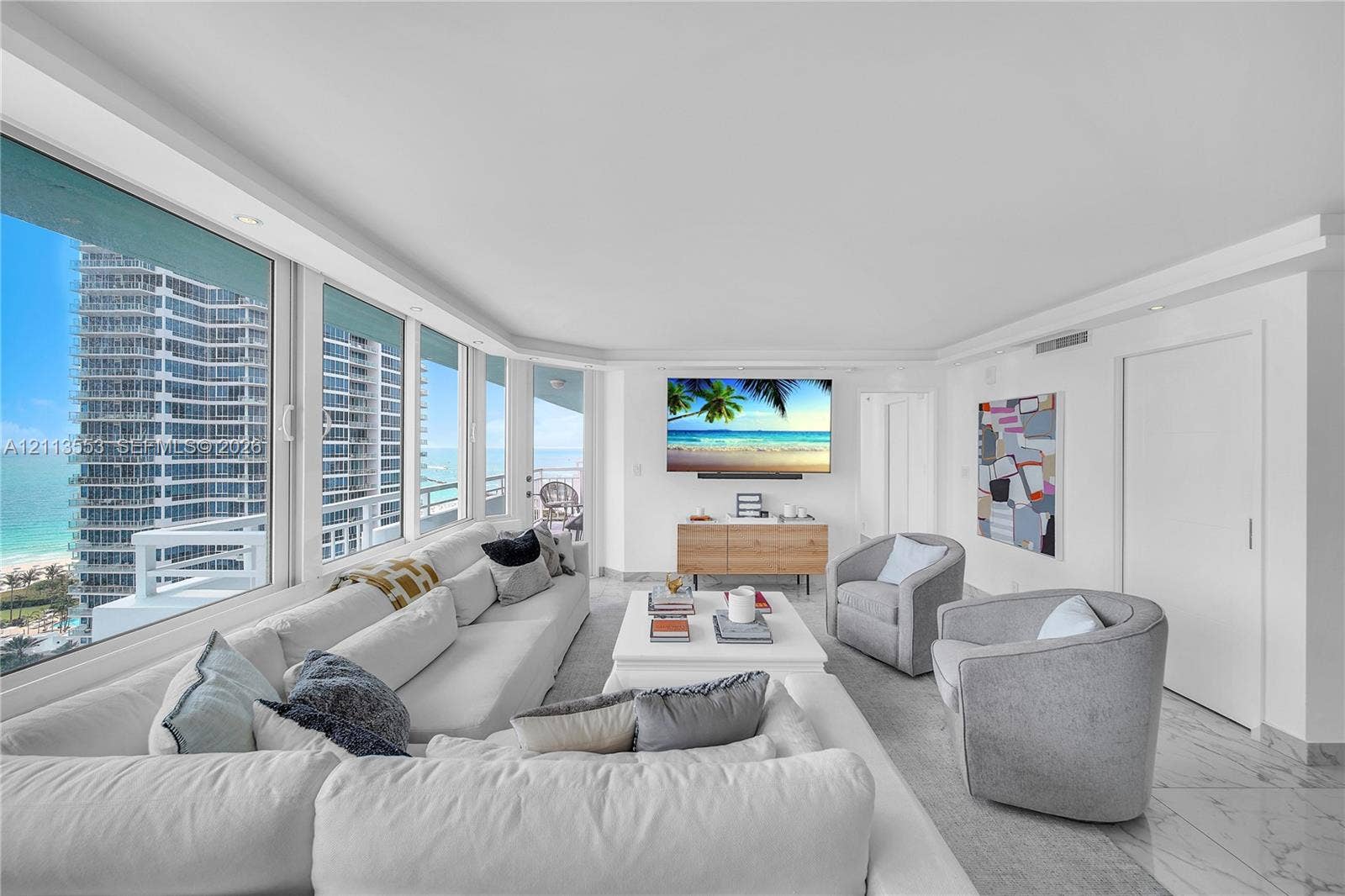 400 S Pointe Drive, #2106, Miami Beach, FL 33139 Floor-to-ceiling windows, stone-finish flooring, recessed ceiling lighting, and built-in door hardware