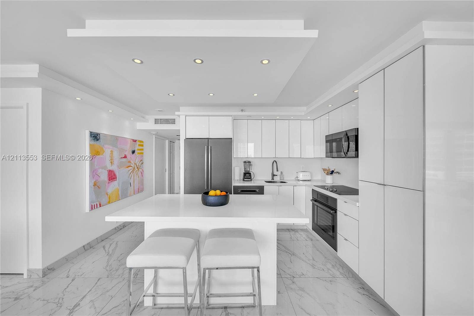 400 S Pointe Drive, #2106, Miami Beach, FL 33139 Kitchen featuring flat-panel white cabinetry, a center island with a stone countertop, recessed lighting, and stone-finish flooring